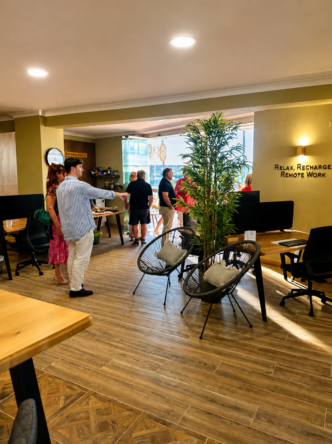 Members networking at an evening event in the workspace